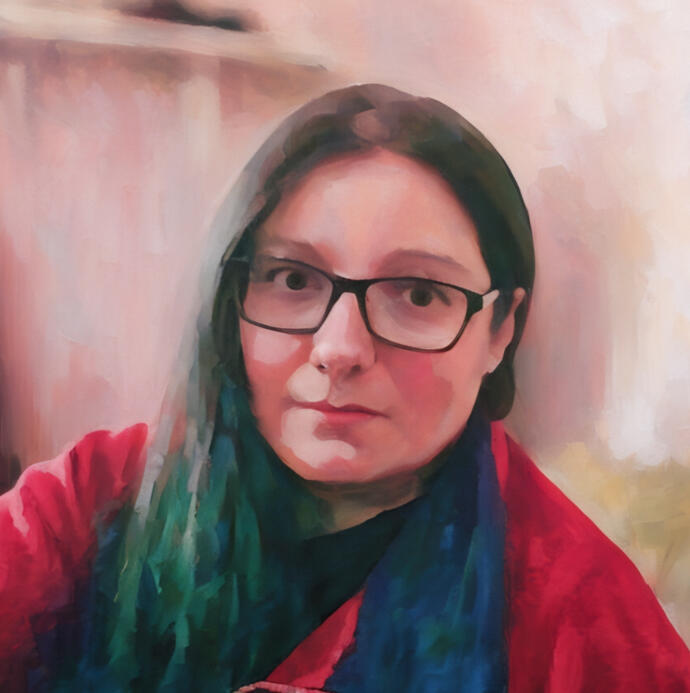 Anna Rouppert A headshot of Anna wearing glasses and red top